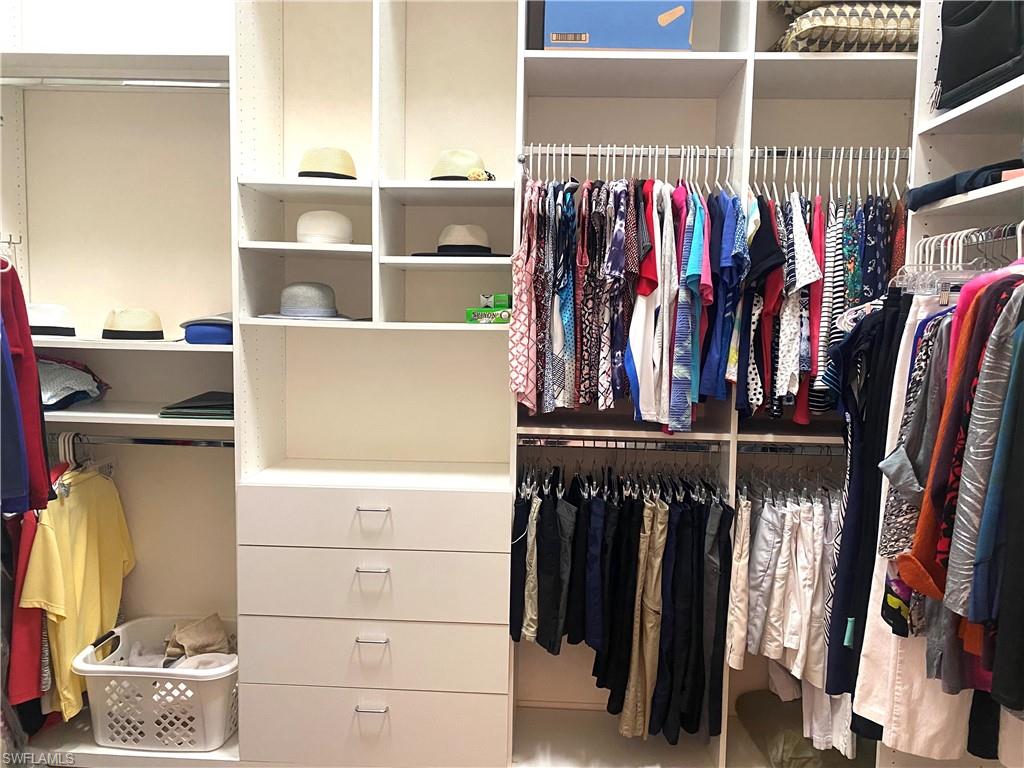 19307 Silver Oak Drive Estero, FL 33967 - Photo 17 of 43 a view of walk in closet with clothes and shoes
