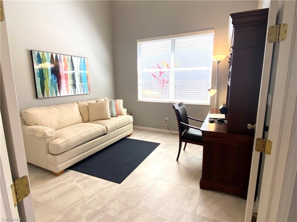 19307 Silver Oak Drive Estero, FL 33967 - Photo 18 of 43 a living room with furniture and a window