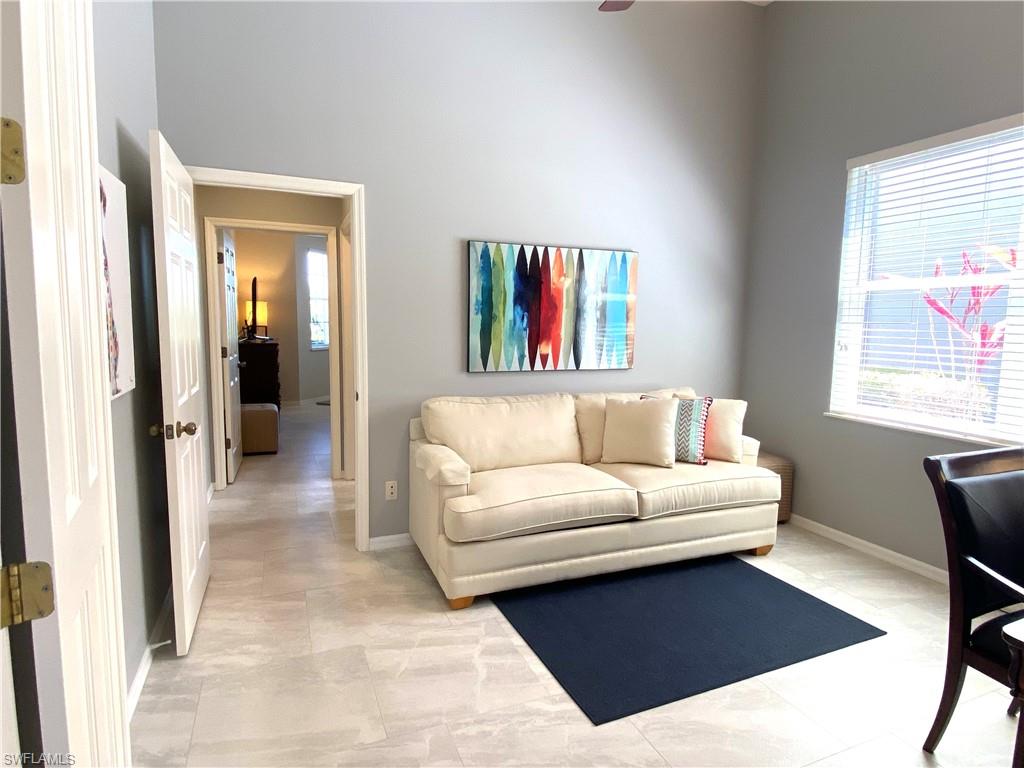 19307 Silver Oak Drive Estero, FL 33967 - Photo 19 of 43 a living room with furniture and a window