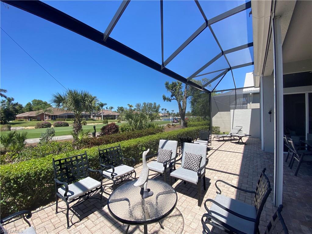 19307 Silver Oak Drive Estero, FL 33967 - Photo 2 of 43 a patio with yard table and chairs