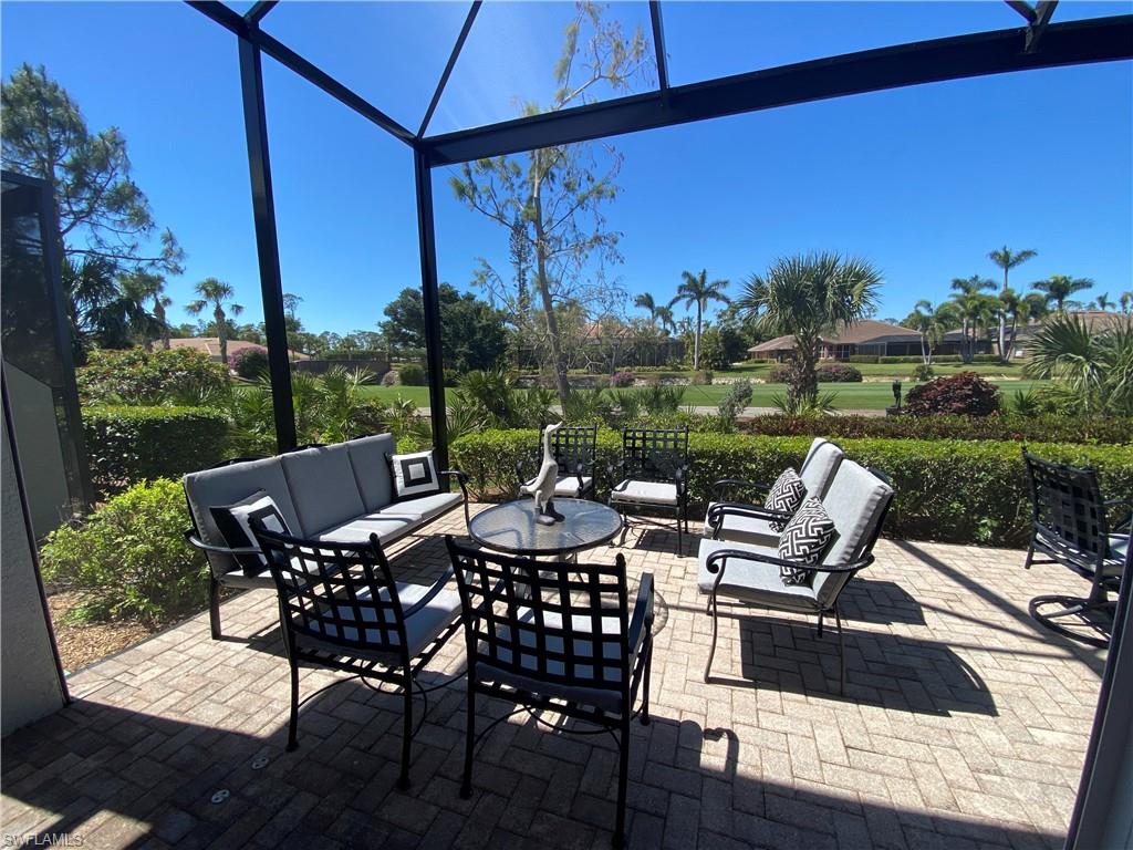 19307 Silver Oak Drive Estero, FL 33967 - Photo 3 of 43 a view of a patio with a table chairs and a patio