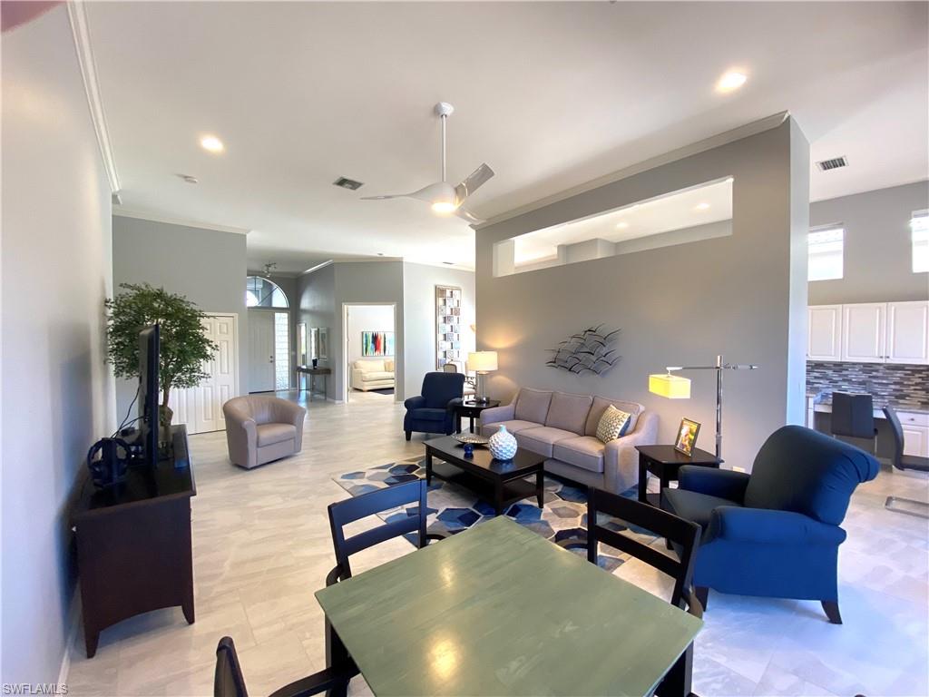 19307 Silver Oak Drive Estero, FL 33967 - Photo 7 of 43 a living room with furniture and a large window