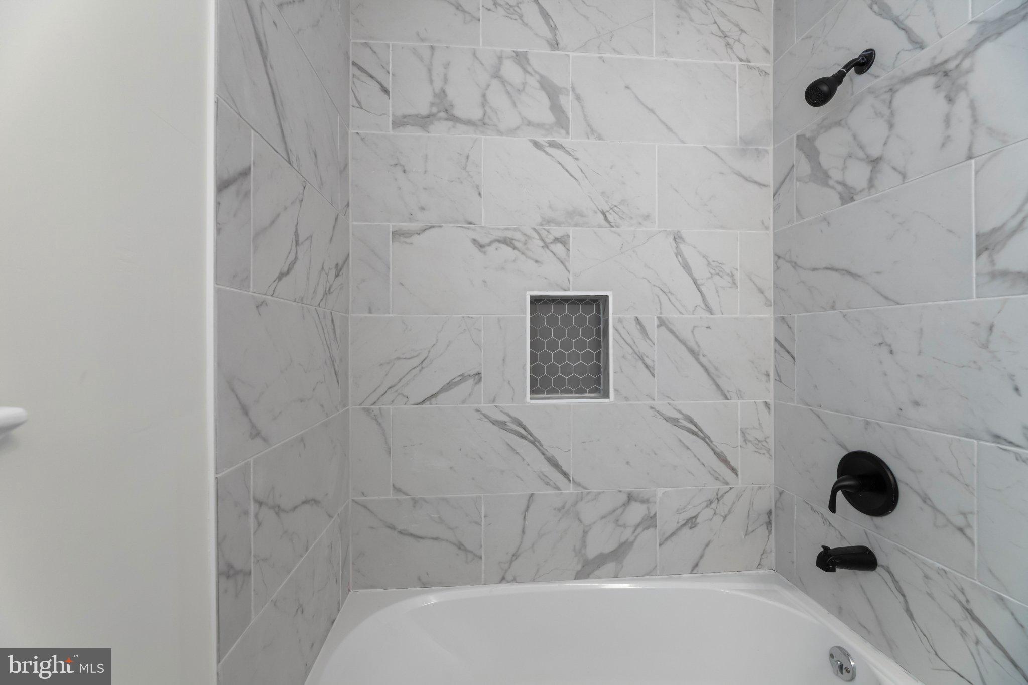 12 Oak Street Cambridge, MD 21613 - Photo 21 of 26 Elegant marble shower retreat.