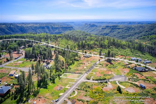 a view of a city with mountains in the background