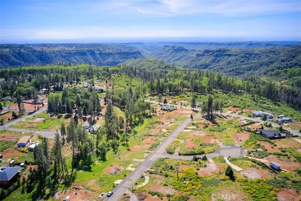 a view of a city with mountains in the background