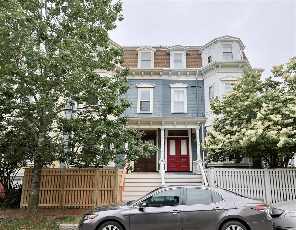 33 Inman Street, Unit 1B Cambridge, MA 02139 - Photo 1 of 12 front view of a house with a yard
