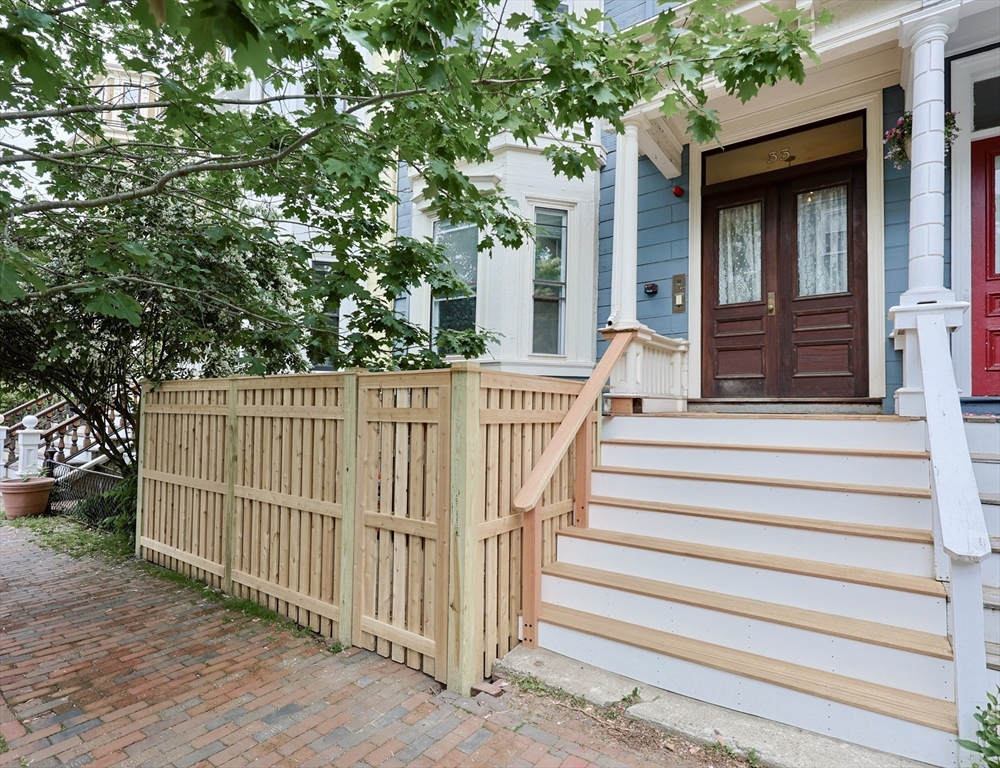 33 Inman Street, Unit 1B Cambridge, MA 02139 - Photo 2 of 12 a view of a house with a small yard