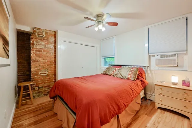 a bedroom with a bed and cabinets