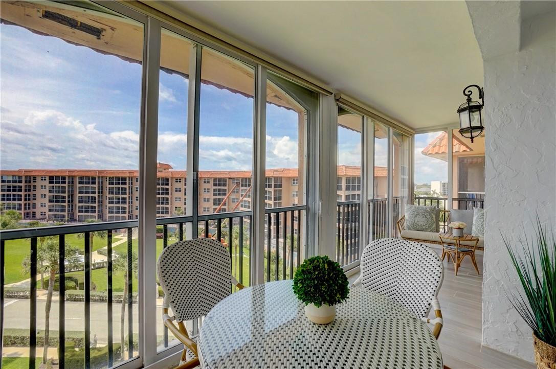 2871 North Ocean Boulevard, Unit C519 Boca Raton, FL 33431 - Photo 14 of 36 a view of a balcony with couch