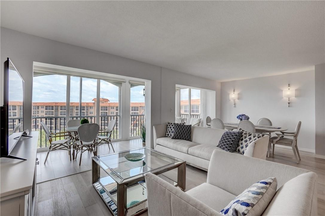 2871 North Ocean Boulevard, Unit C519 Boca Raton, FL 33431 - Photo 16 of 36 a living room with furniture and a large window