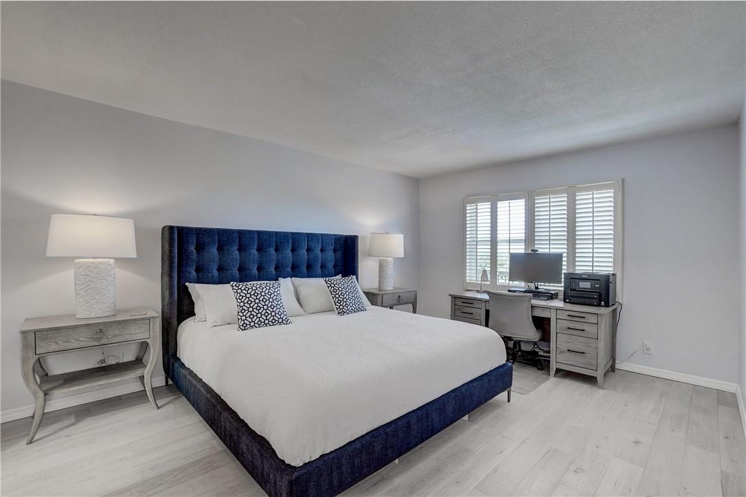 2871 North Ocean Boulevard, Unit C519 Boca Raton, FL 33431 - Photo 17 of 36 a large bedroom with a bed and window