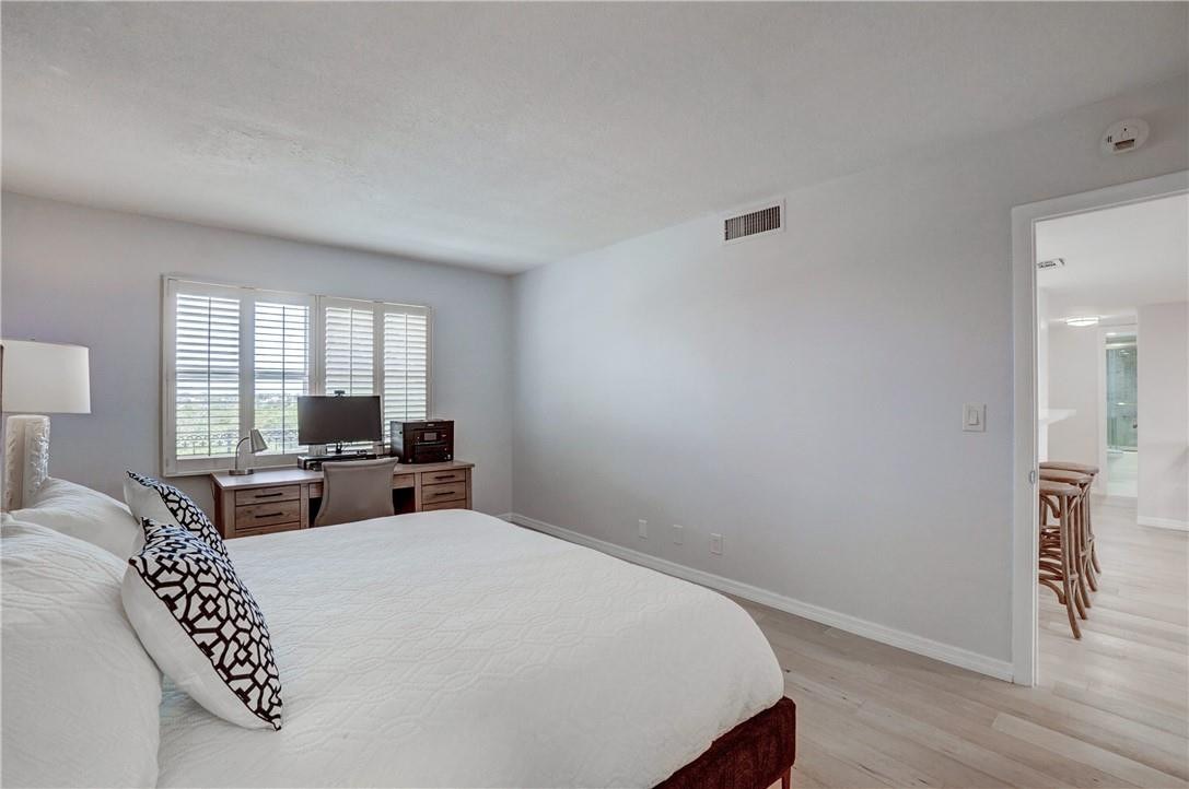 2871 North Ocean Boulevard, Unit C519 Boca Raton, FL 33431 - Photo 20 of 36 a bed room with a bed window and a chair