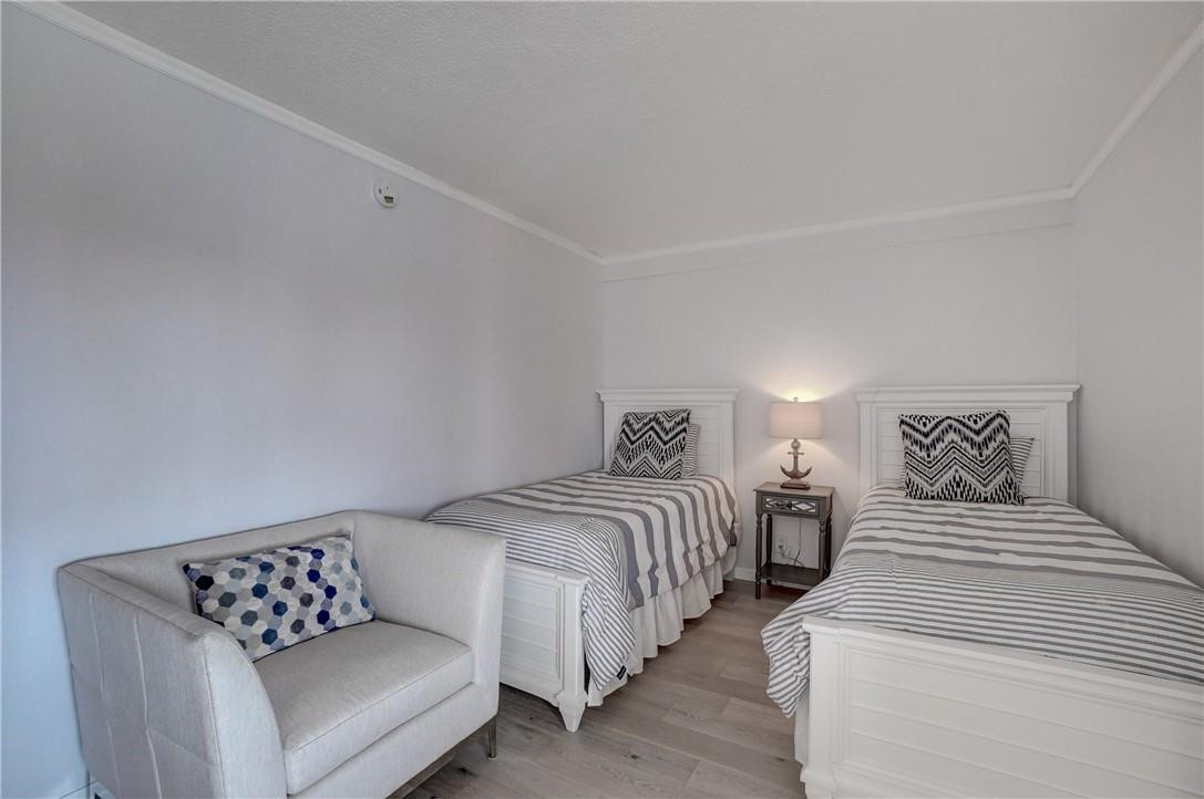 2871 North Ocean Boulevard, Unit C519 Boca Raton, FL 33431 - Photo 22 of 36 a bedroom with bed and a couch