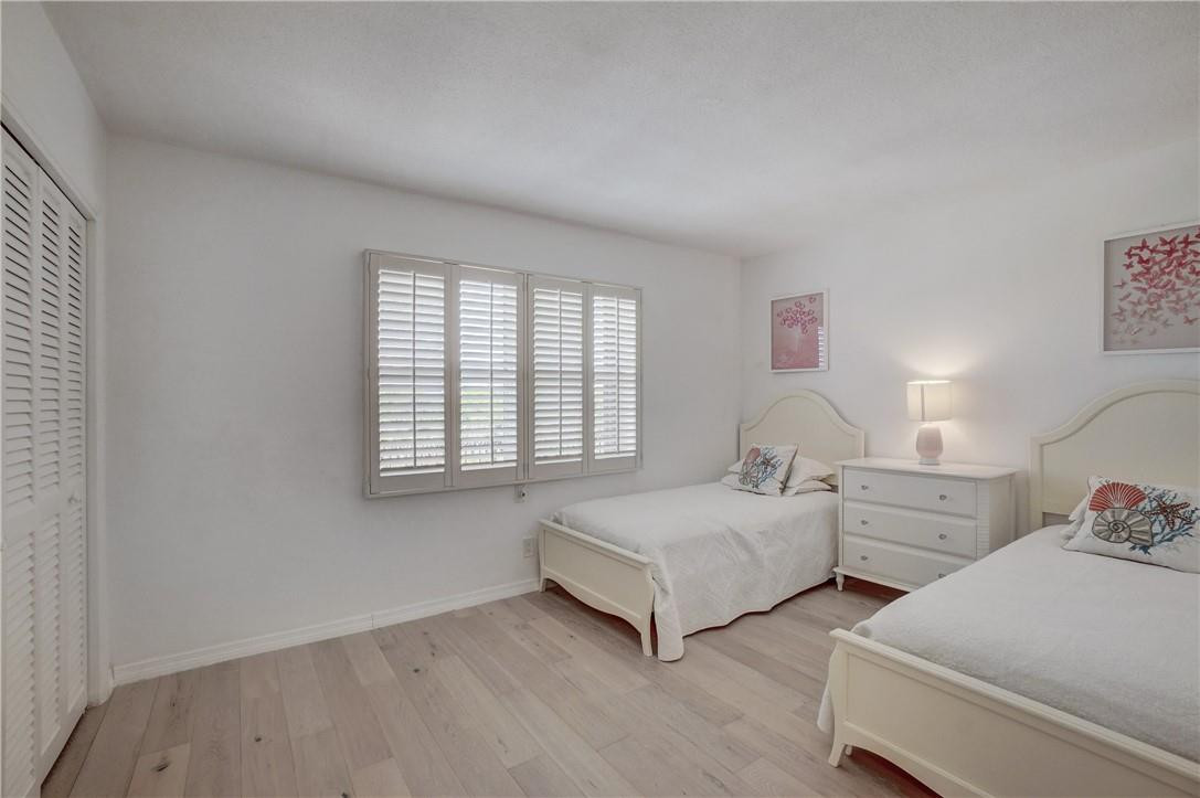 2871 North Ocean Boulevard, Unit C519 Boca Raton, FL 33431 - Photo 23 of 36 a spacious bedroom with two beds and a window