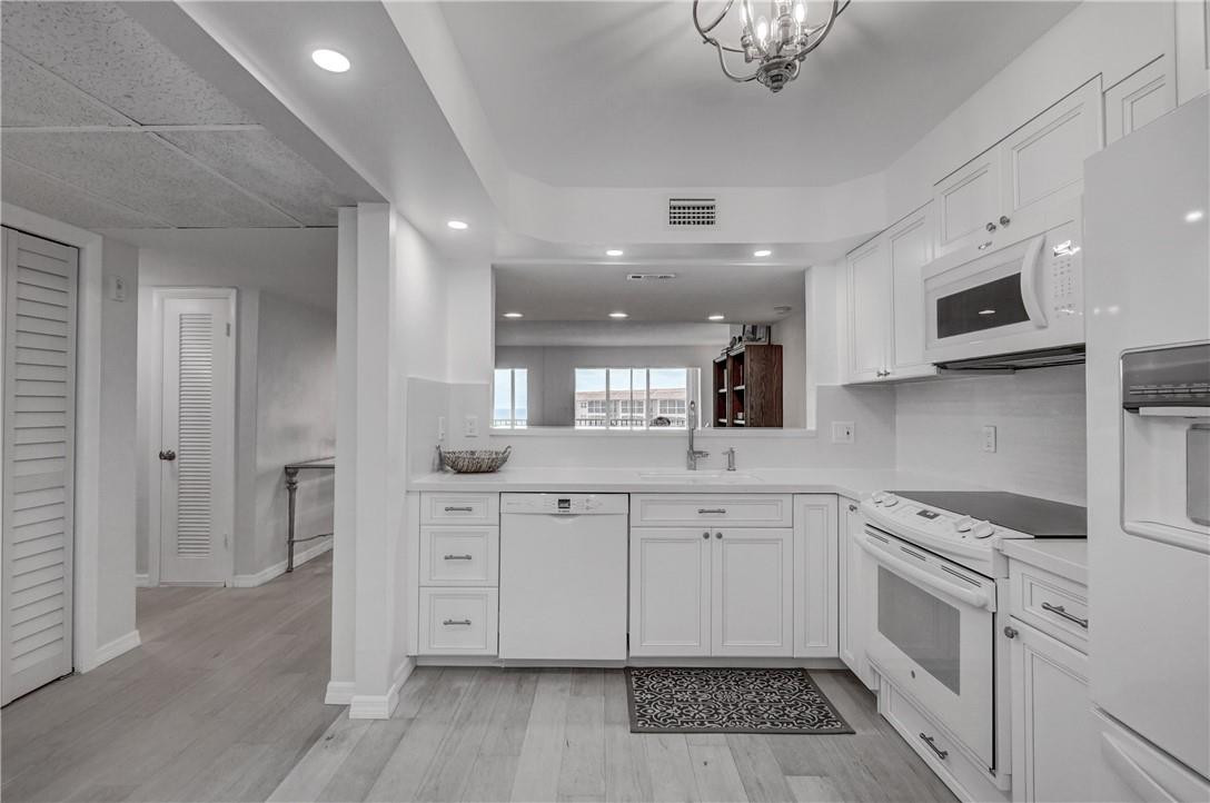 2871 North Ocean Boulevard, Unit C519 Boca Raton, FL 33431 - Photo 3 of 36 a kitchen with stainless steel appliances granite countertop a sink and cabinets