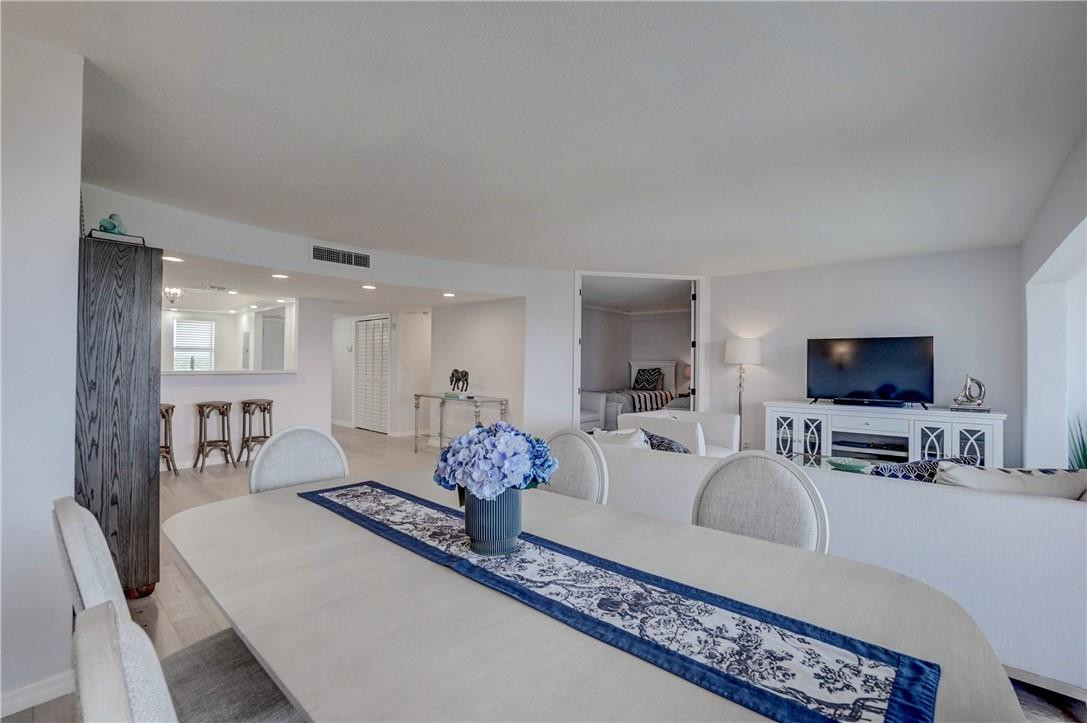 2871 North Ocean Boulevard, Unit C519 Boca Raton, FL 33431 - Photo 9 of 36 a living room with furniture and a flat screen tv