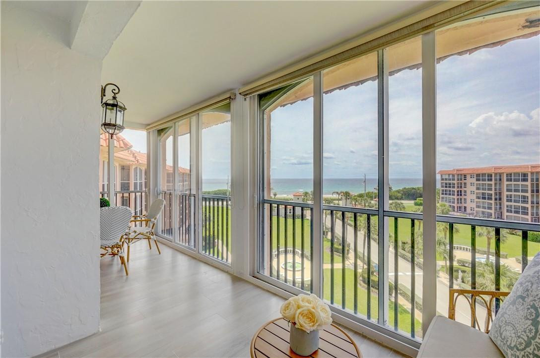 2871 North Ocean Boulevard, Unit C519 Boca Raton, FL 33431 - Photo 10 of 36 a view of workspace with furniture and floor to ceiling windows