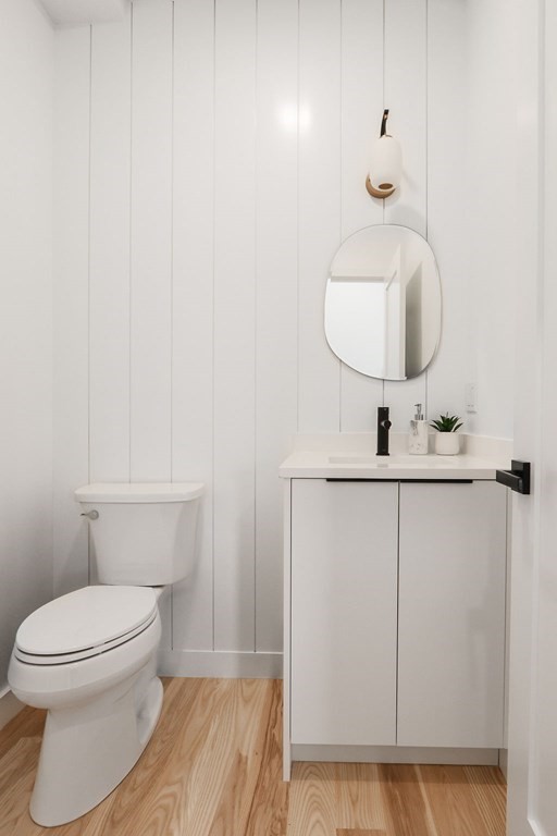 41 Nathan Road, Unit 1 Waltham, MA 02453 - Photo 15 of 25 a bathroom with a toilet sink and mirror