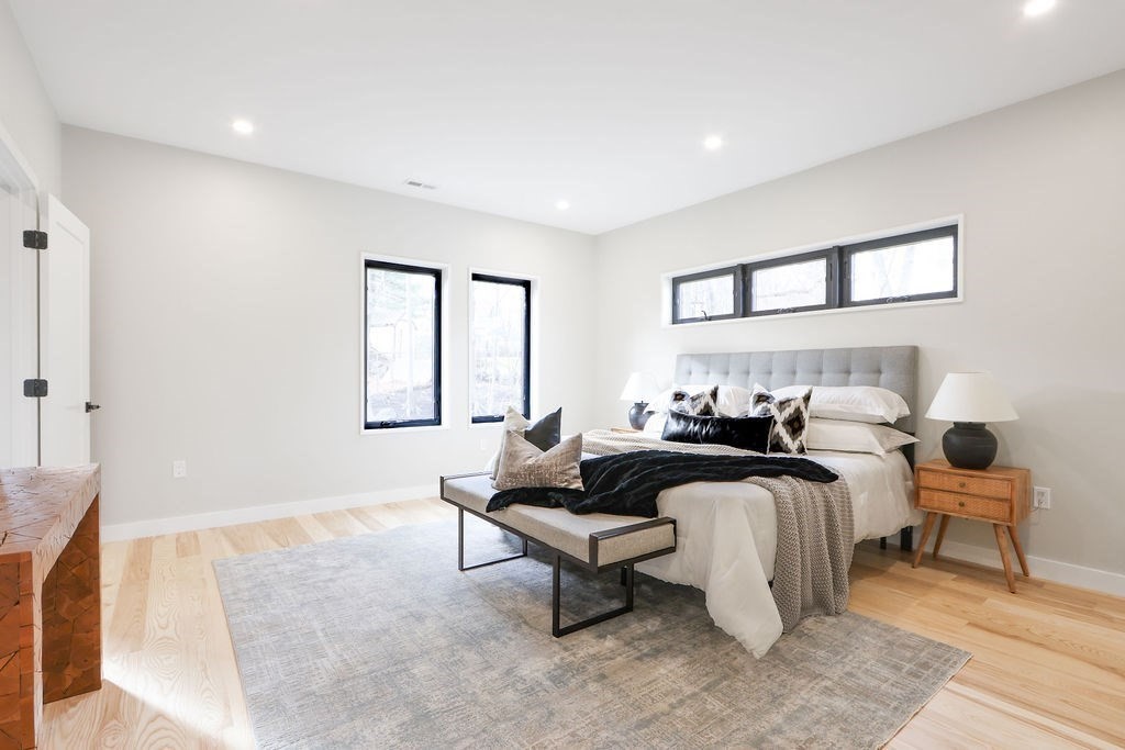 41 Nathan Road, Unit 1 Waltham, MA 02453 - Photo 16 of 25 a living room with furniture and a potted plant