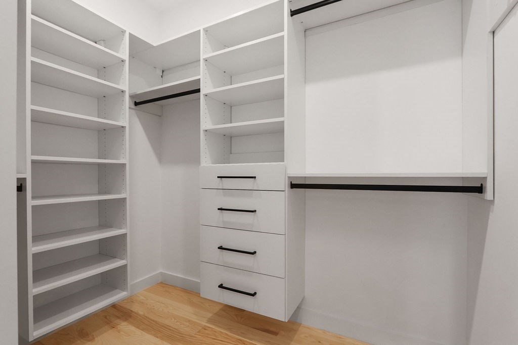 41 Nathan Road, Unit 1 Waltham, MA 02453 - Photo 19 of 25 a view of walk in closet with empty racks