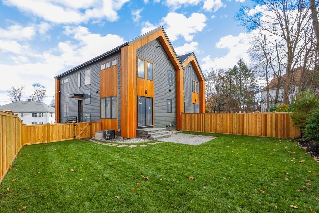 41 Nathan Road, Unit 1 Waltham, MA 02453 - Photo 2 of 25 a front view of house with yard and entertaining space