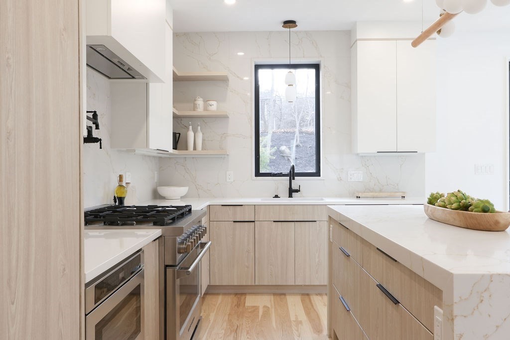 41 Nathan Road, Unit 1 Waltham, MA 02453 - Photo 5 of 25 a kitchen with a sink stove and cabinets