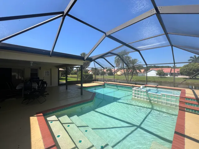 a view of a swimming pool with a patio