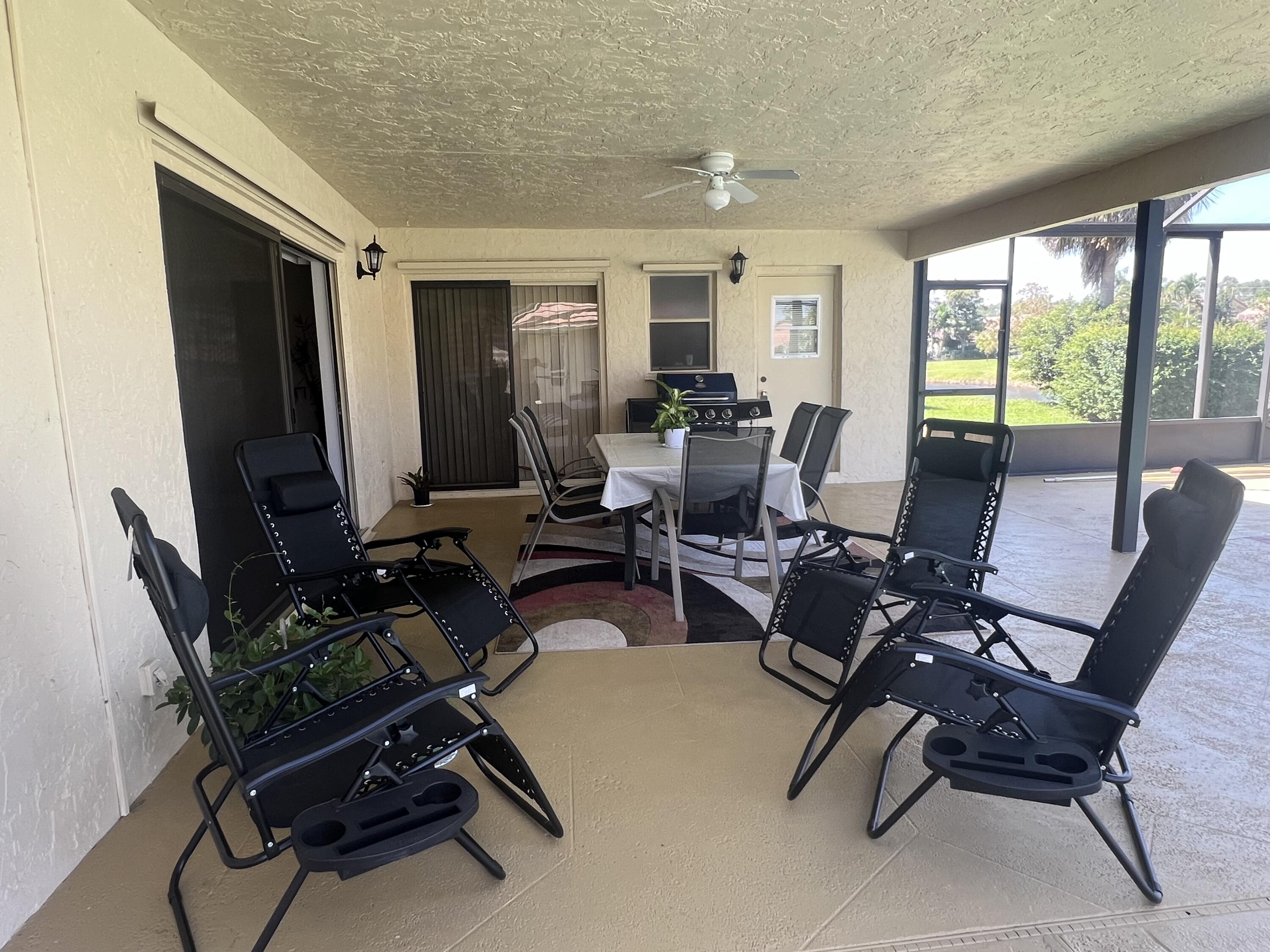 9775 Sun Pointe Drive Boynton Beach, FL 33437 - Photo 18 of 30 a workspace with furniture window and outside view