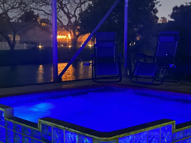 a view of a red building with swimming pool