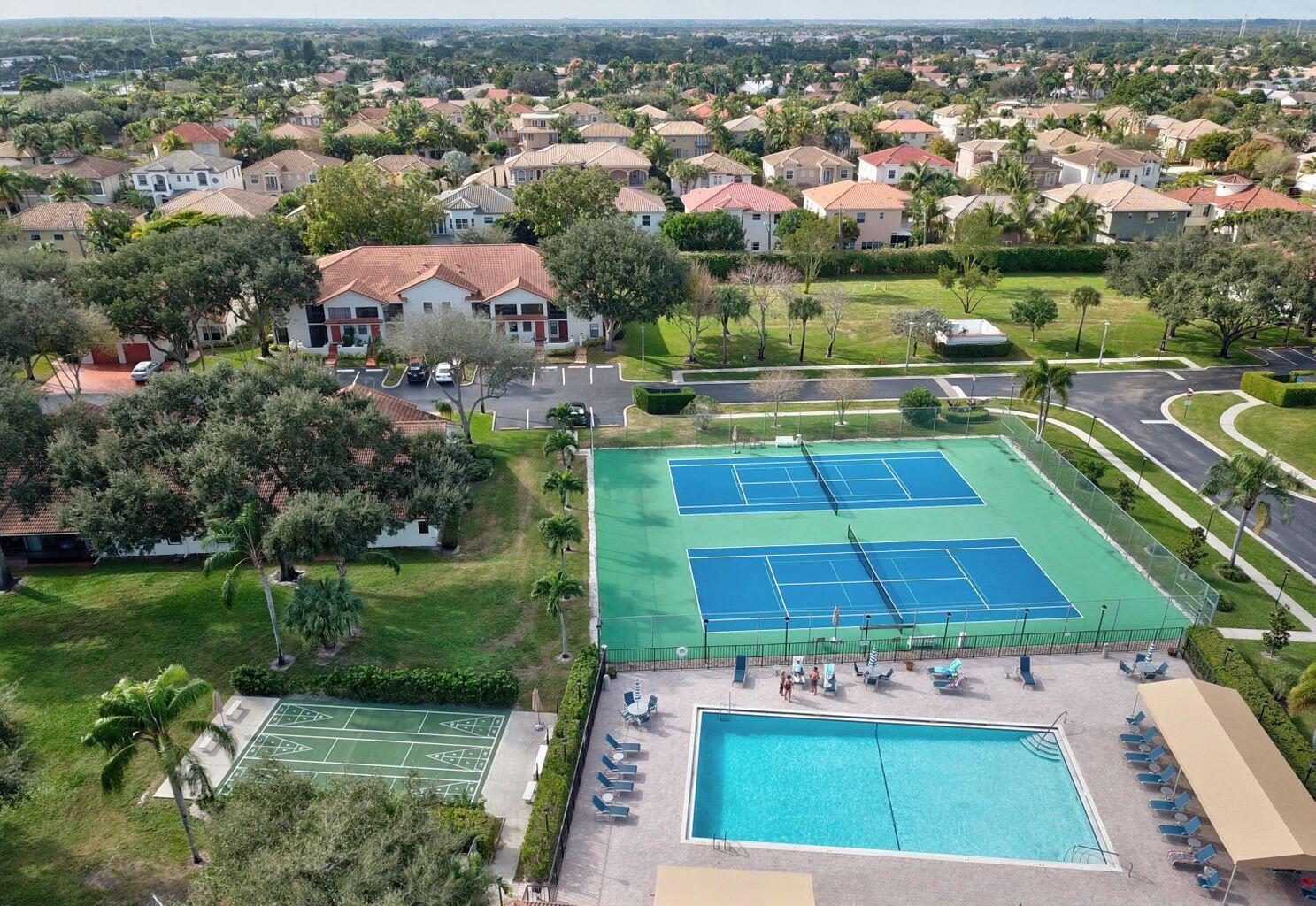9775 Sun Pointe Drive Boynton Beach, FL 33437 - Photo 28 of 30 a view of a tennis court