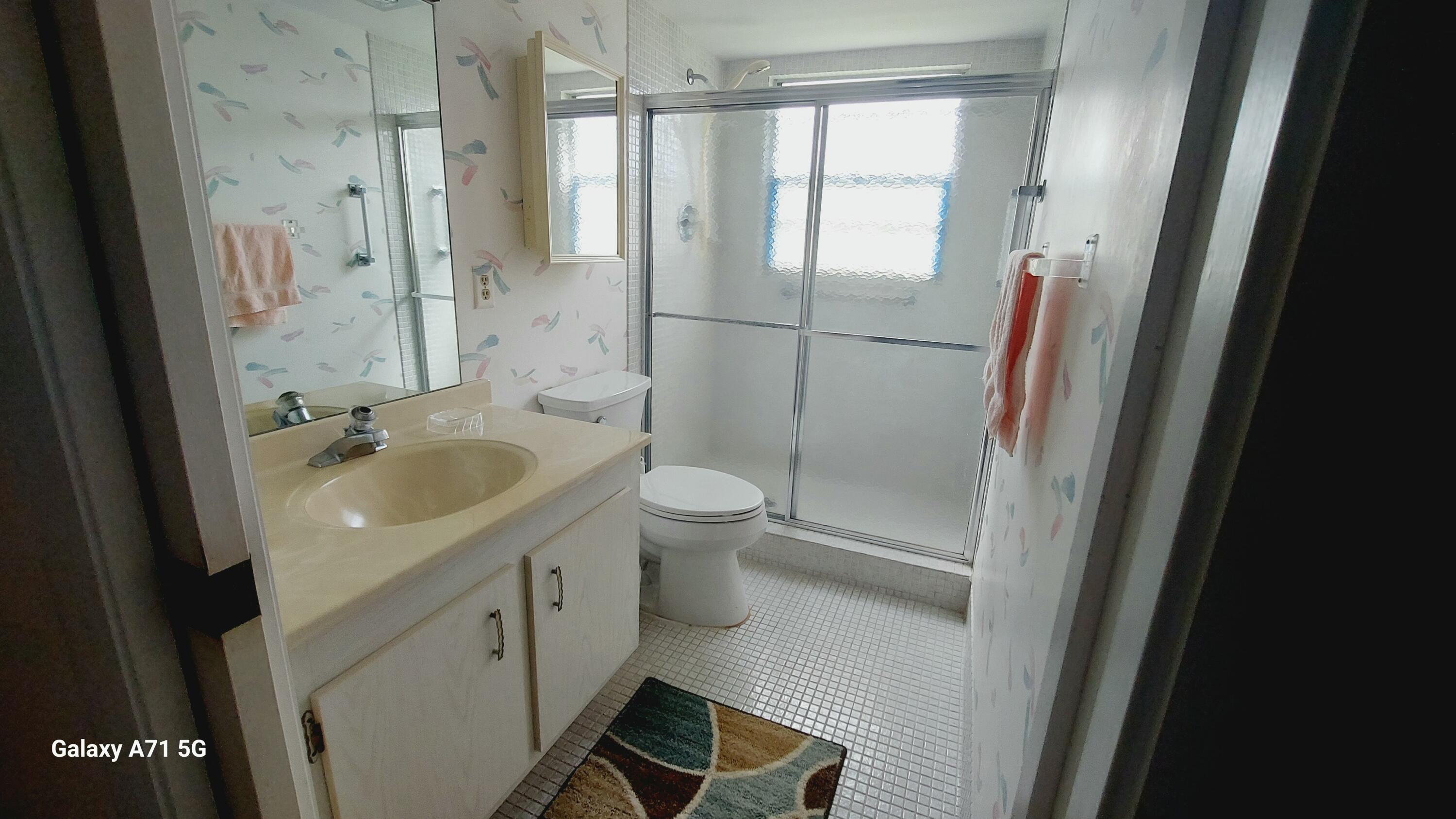 2001 Yarmouth Drive, Unit 2001 Boca Raton, FL 33434 - Photo 12 of 39 guest bath