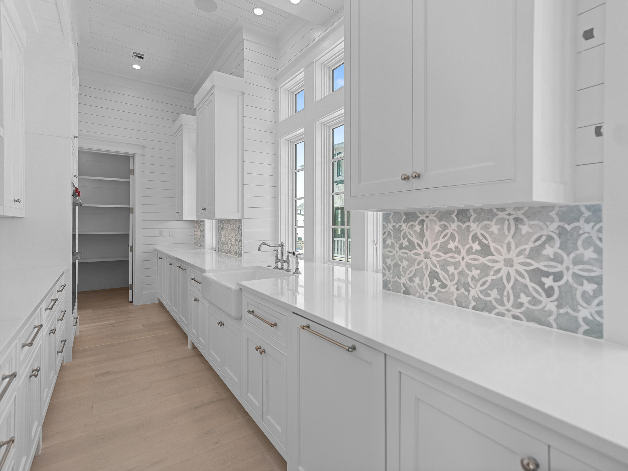 264 Grace Pt Way Watersound, FL 32461 - Photo 12 of 69 a large white kitchen with granite countertop a sink