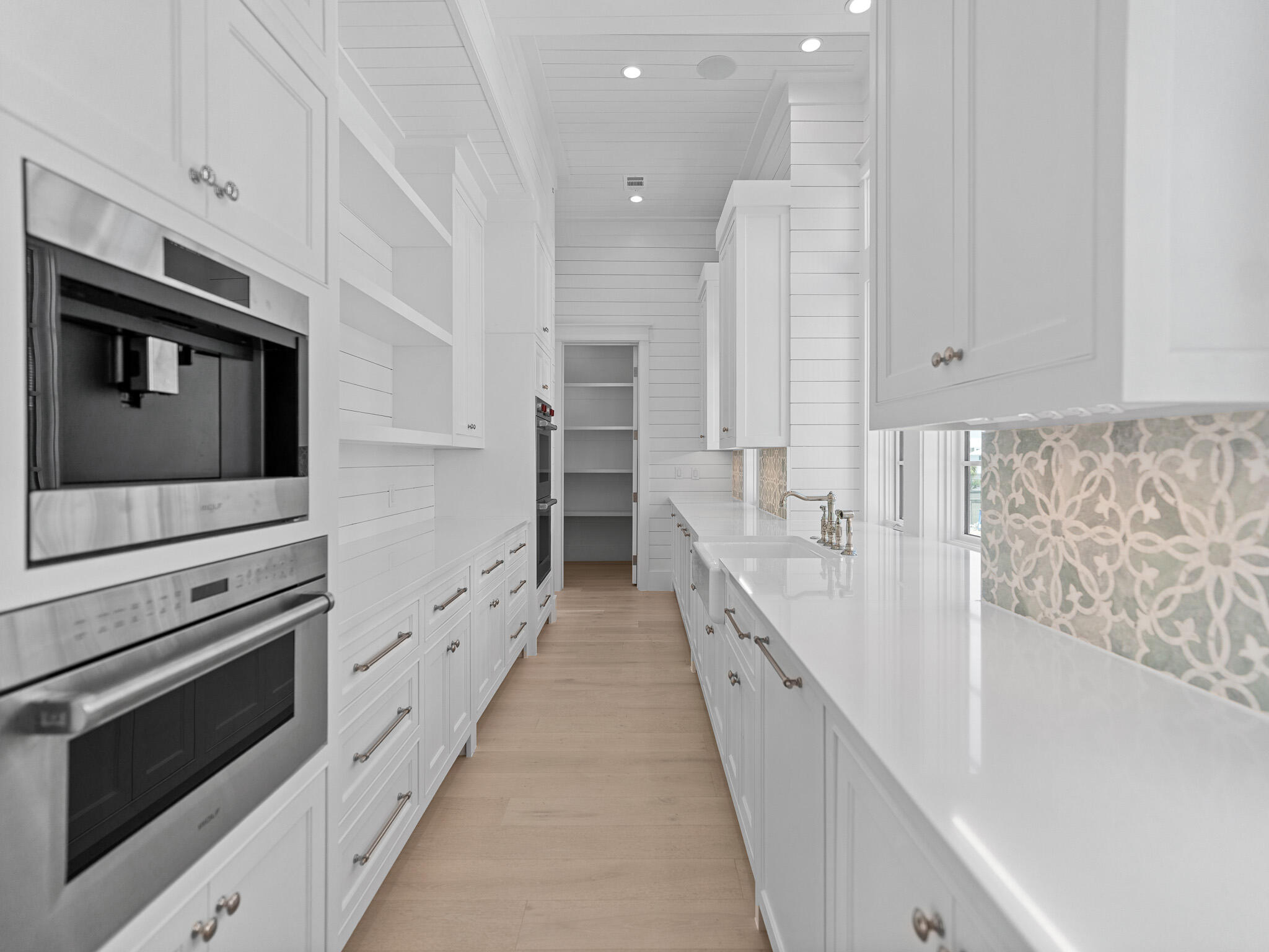 264 Grace Pt Way Watersound, FL 32461 - Photo 13 of 69 a kitchen with stainless steel appliances a stove microwave and cabinets