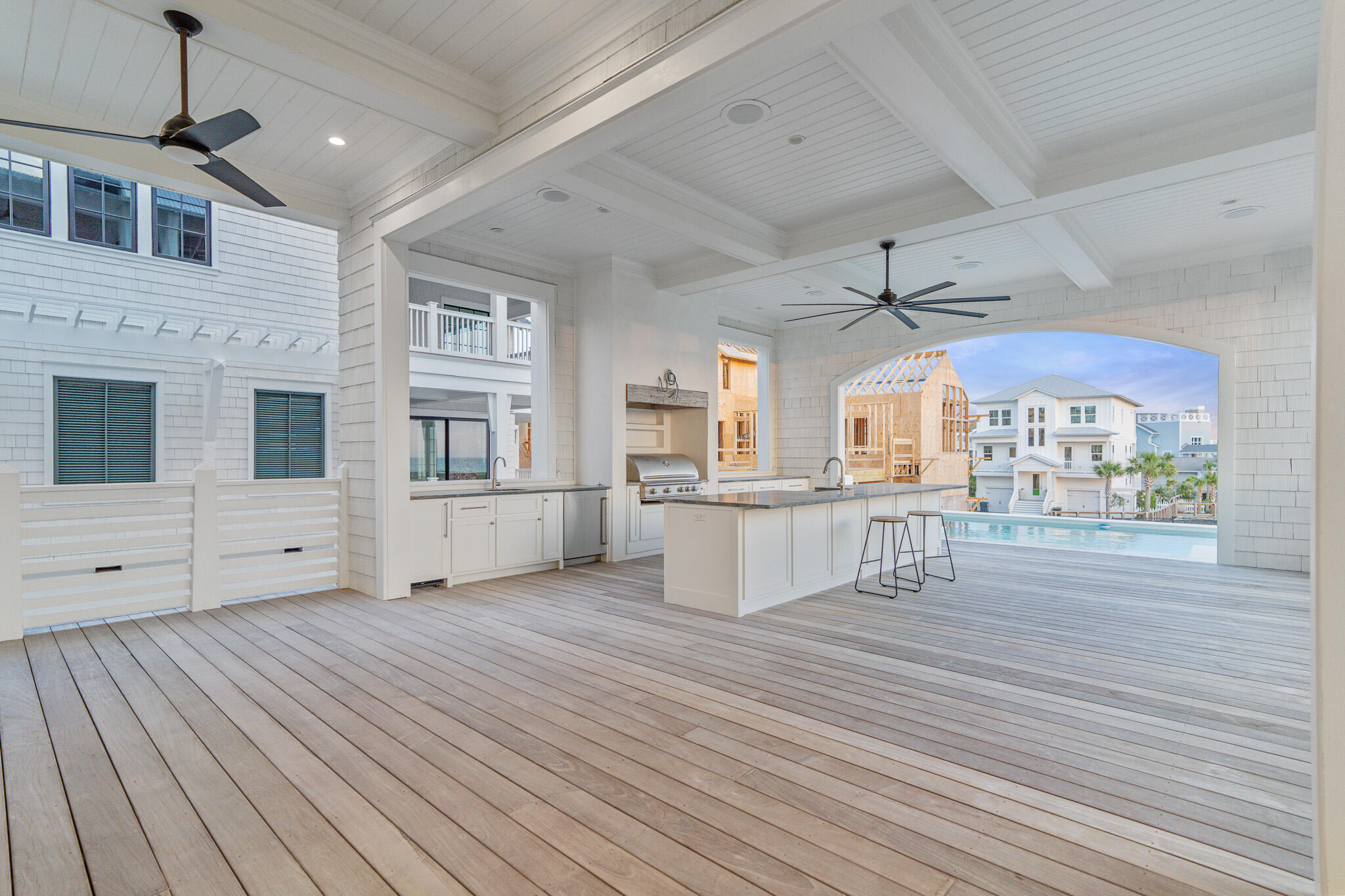 264 Grace Pt Way Watersound, FL 32461 - Photo 17 of 69 a view of a kitchen with wooden floor and a ceiling fan