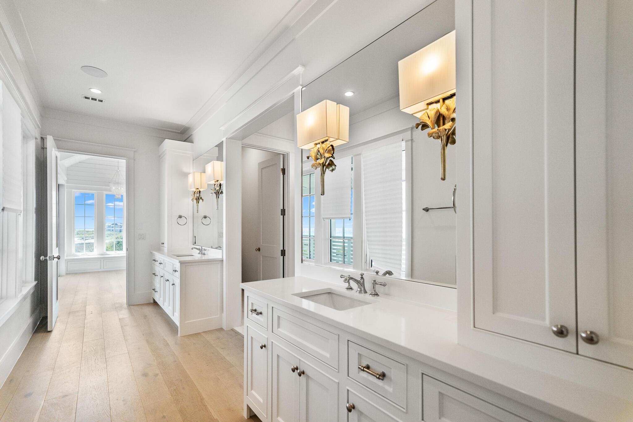 264 Grace Pt Way Watersound, FL 32461 - Photo 24 of 69 a bathroom with a sink a mirror and a shower