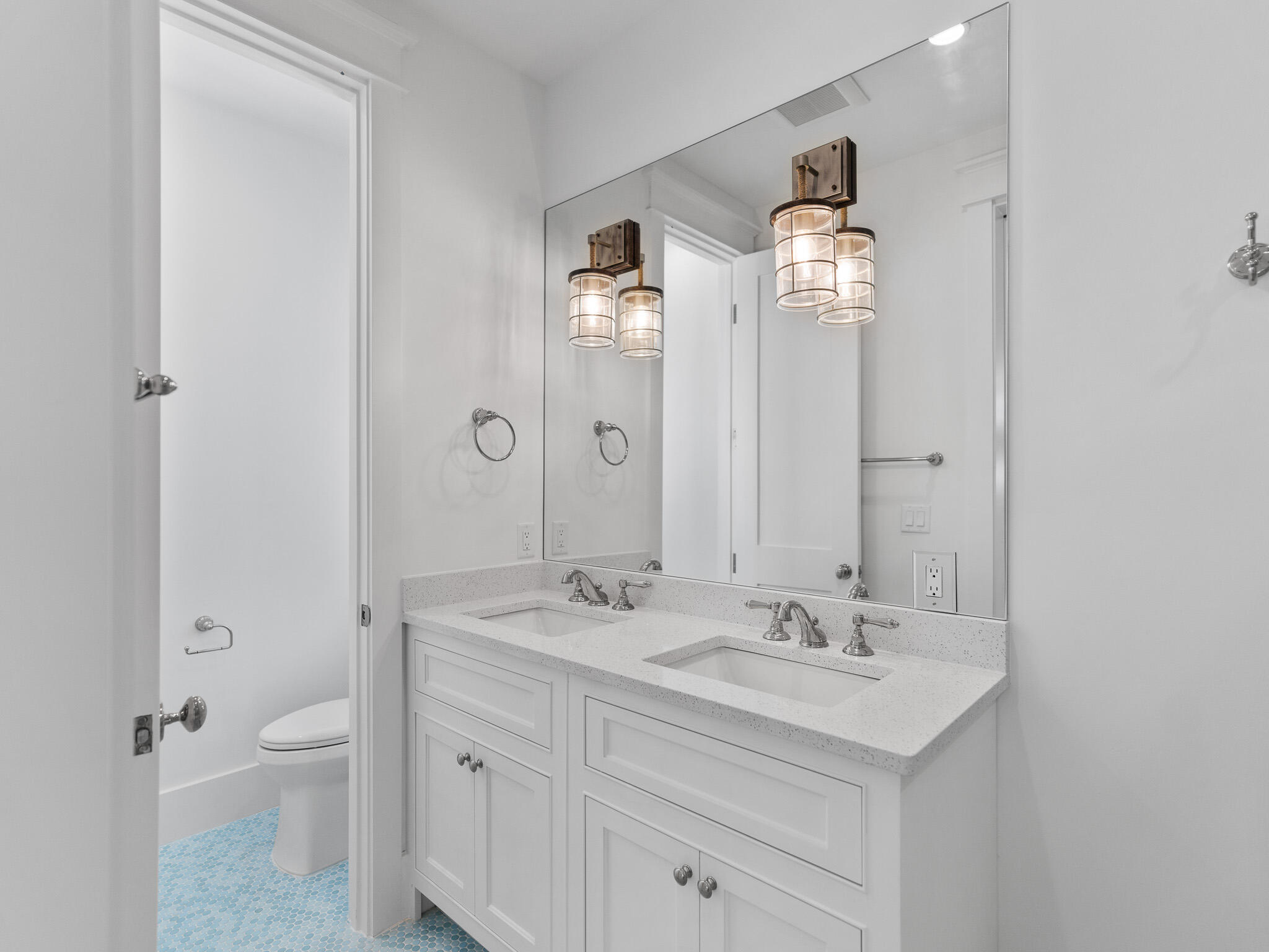 264 Grace Pt Way Watersound, FL 32461 - Photo 28 of 69 a bathroom with a double vanity sink and a mirror