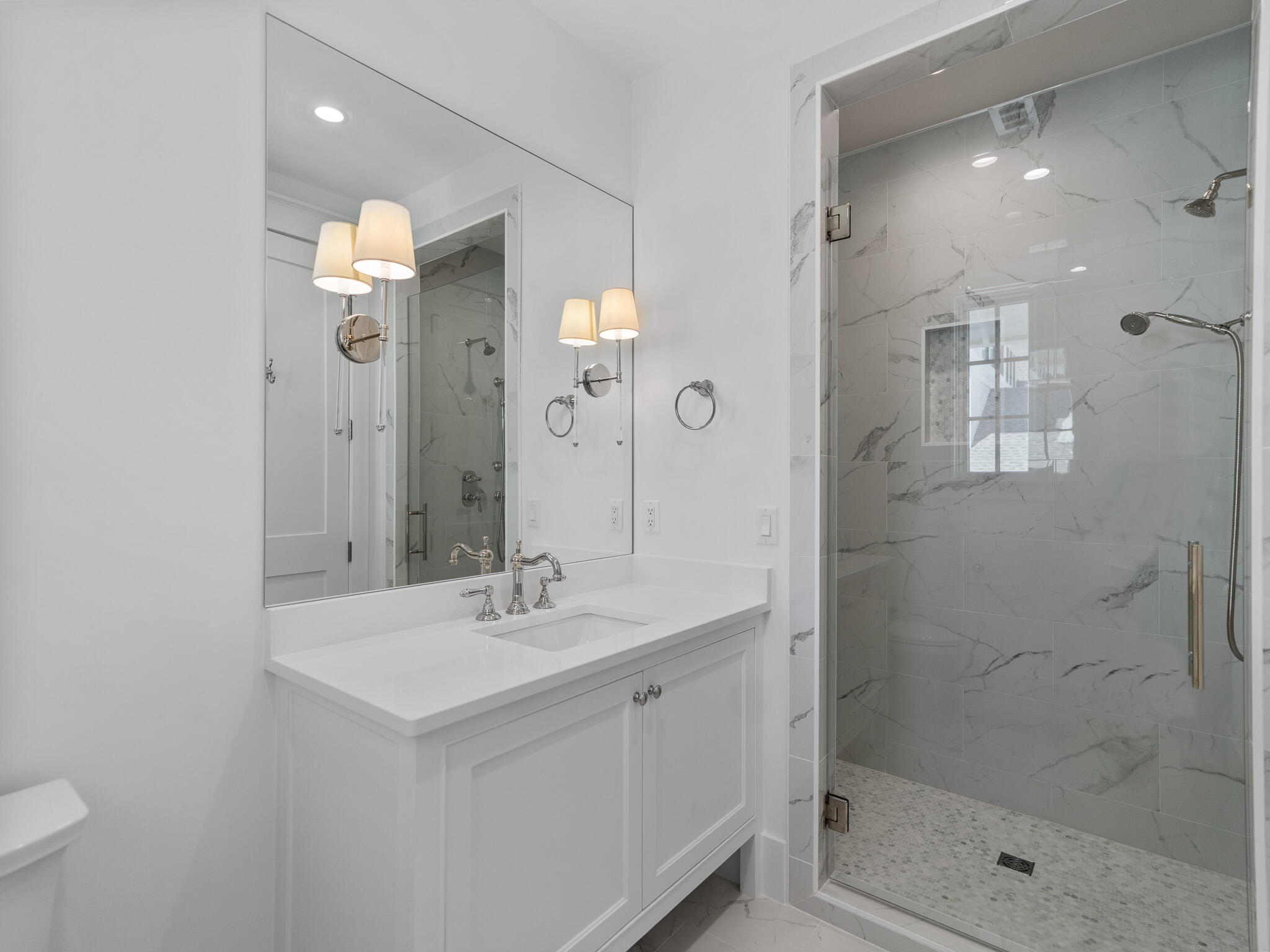 264 Grace Pt Way Watersound, FL 32461 - Photo 31 of 69 a bathroom with a shower sink vanity and mirror