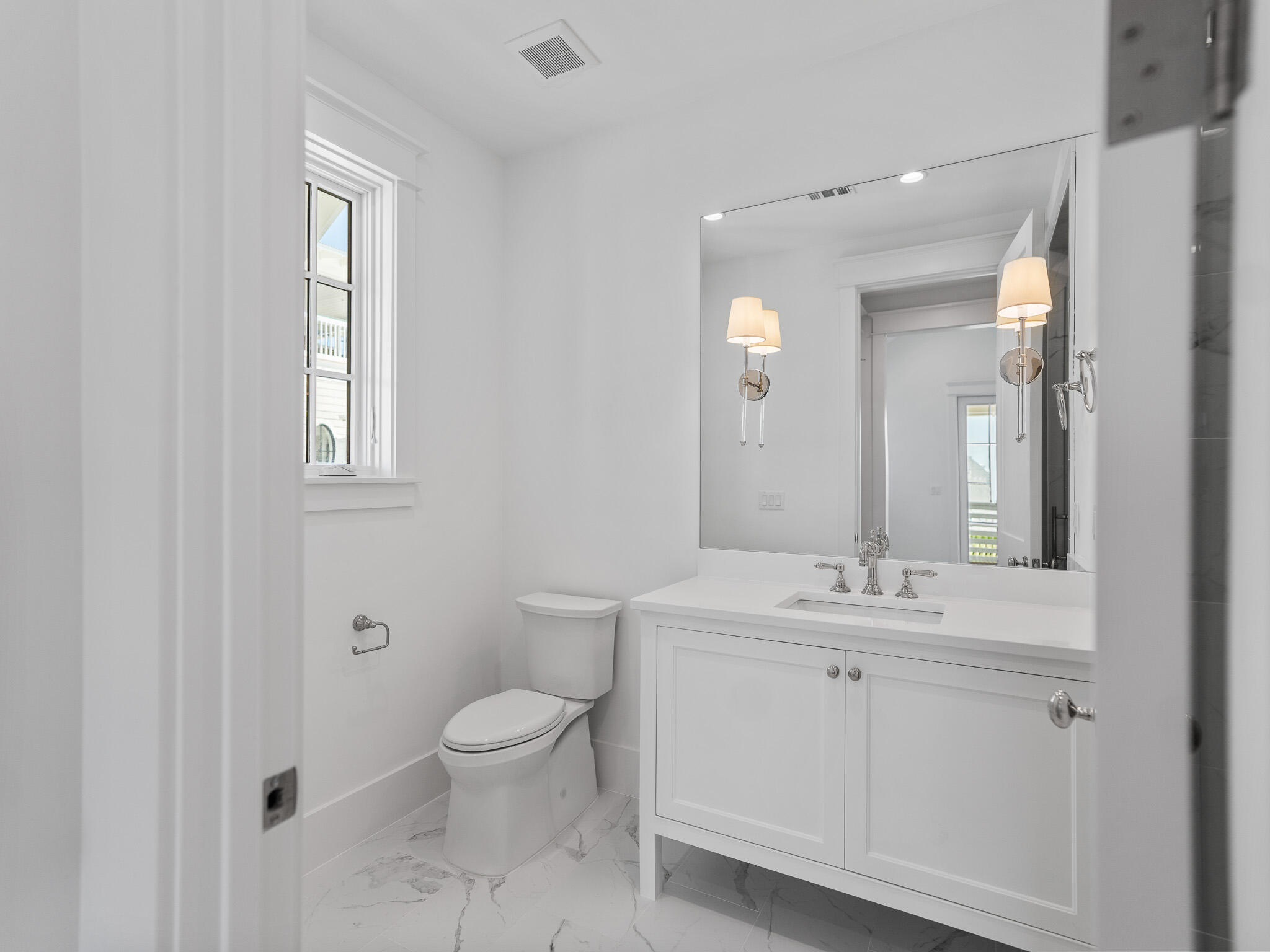 264 Grace Pt Way Watersound, FL 32461 - Photo 32 of 69 a bathroom with a toilet sink and mirror