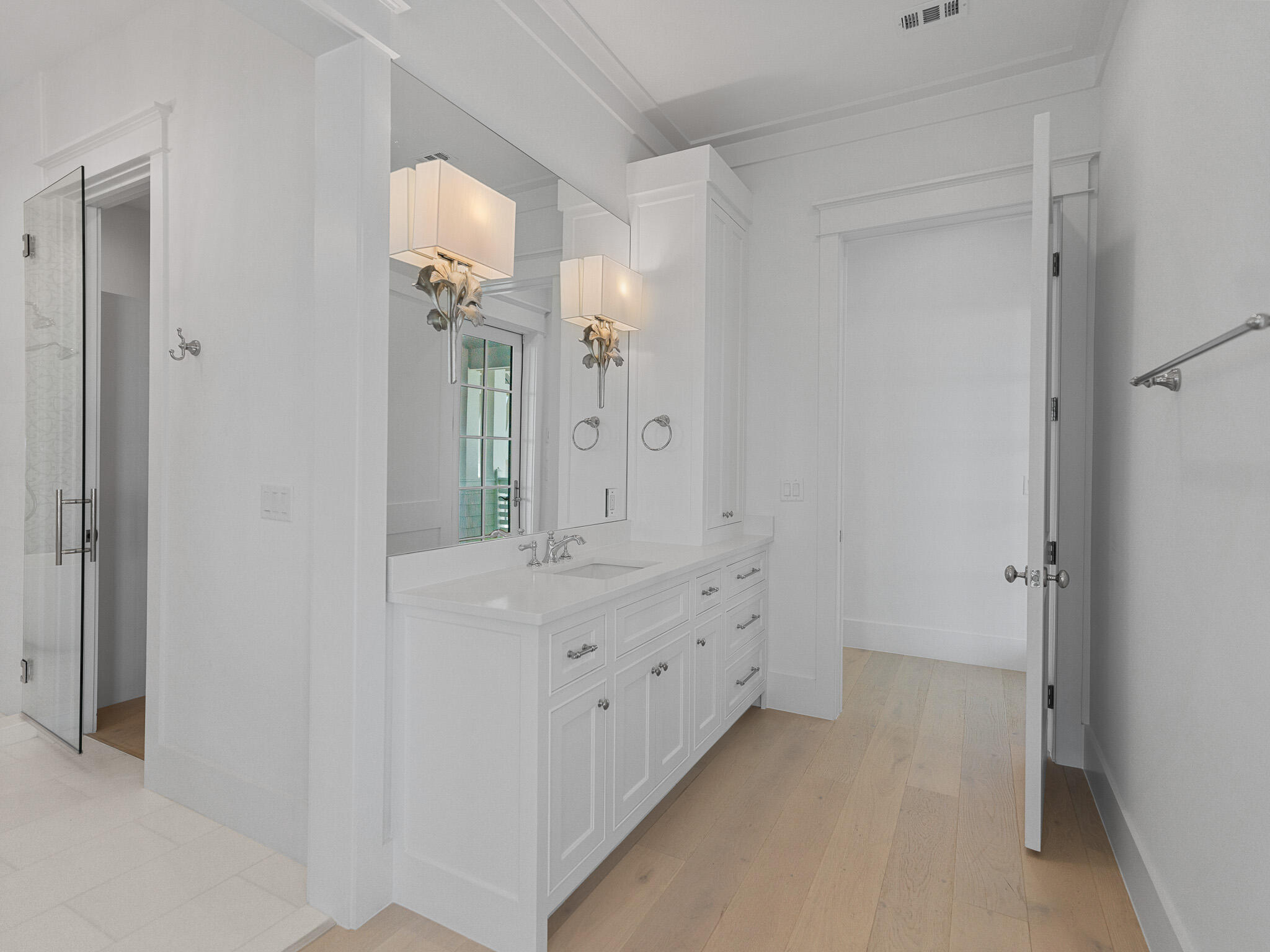 264 Grace Pt Way Watersound, FL 32461 - Photo 38 of 69 a bathroom with a double vanity sink and mirror with shower