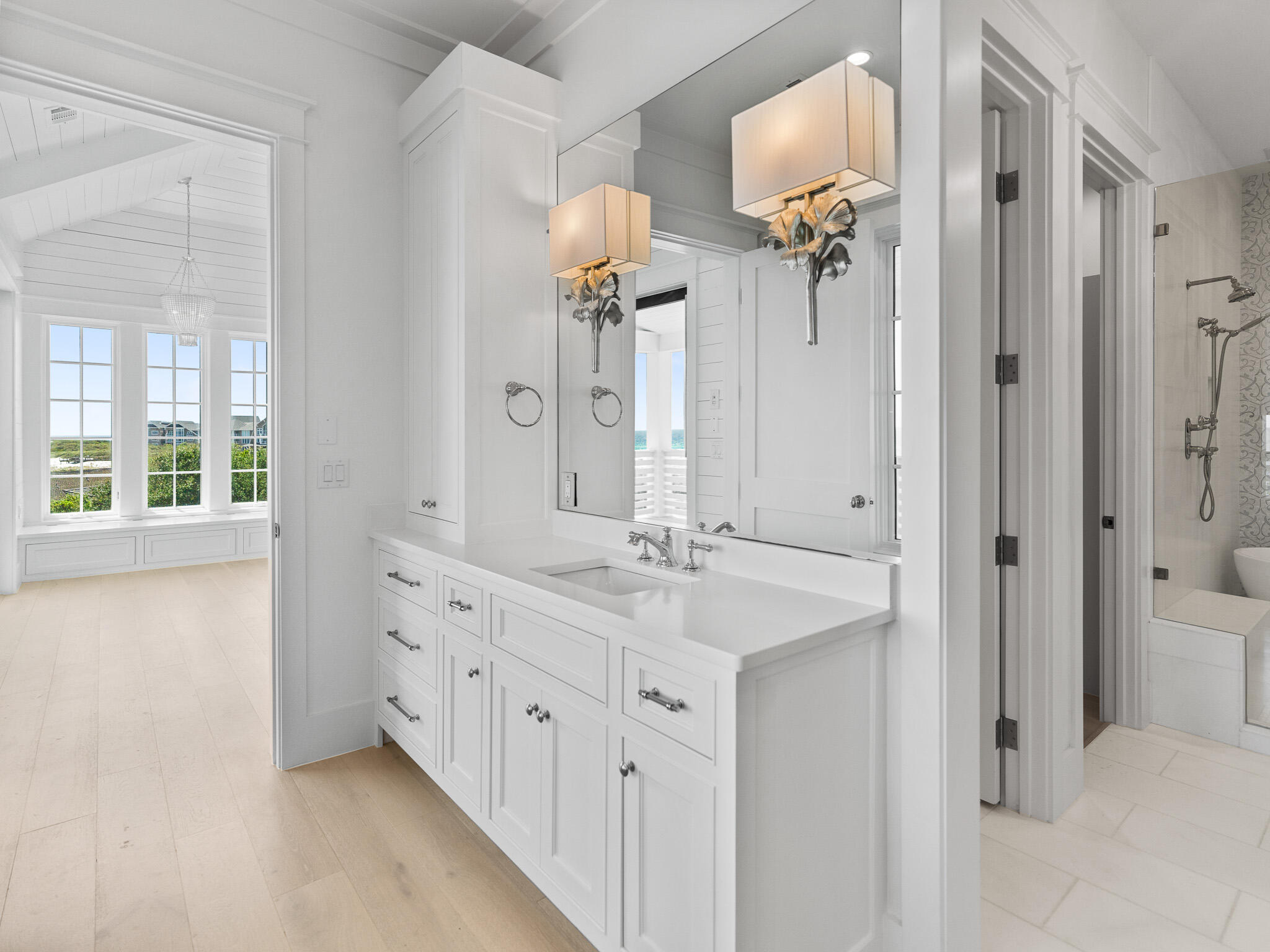 264 Grace Pt Way Watersound, FL 32461 - Photo 42 of 69 a bathroom with a double vanity sink a mirror and a shower