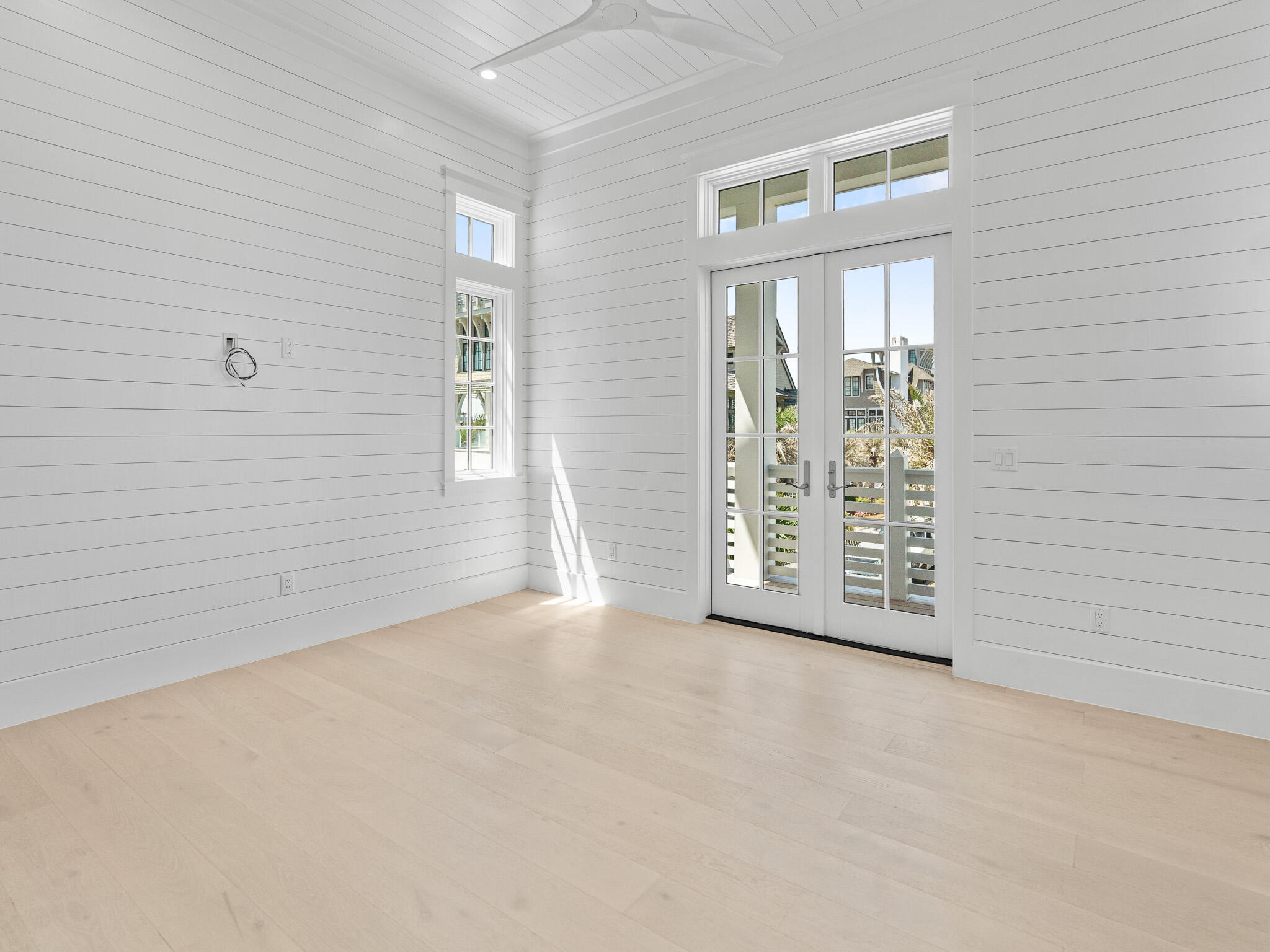 264 Grace Pt Way Watersound, FL 32461 - Photo 44 of 69 a view of an empty room with windows
