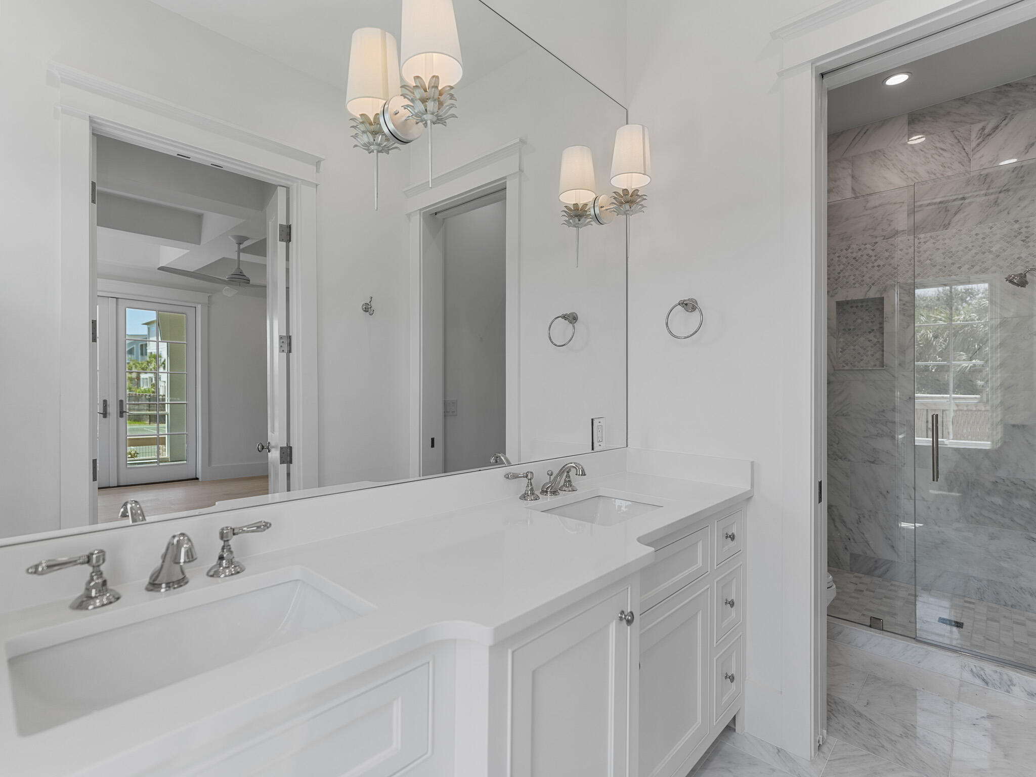 264 Grace Pt Way Watersound, FL 32461 - Photo 57 of 69 a bathroom with a double vanity sink mirror and shower