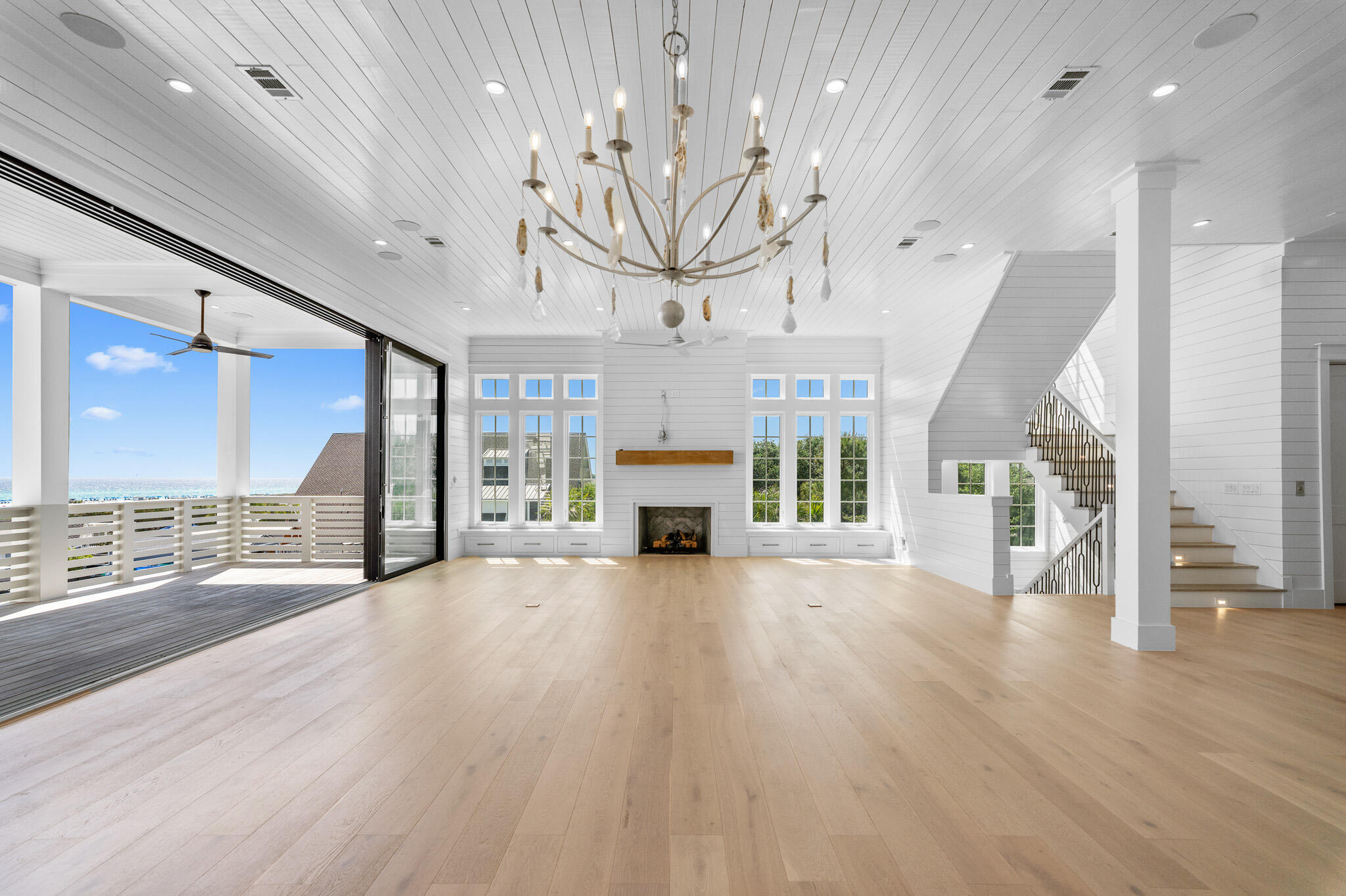 264 Grace Pt Way Watersound, FL 32461 - Photo 6 of 69 a view of an empty room with a fireplace and a window