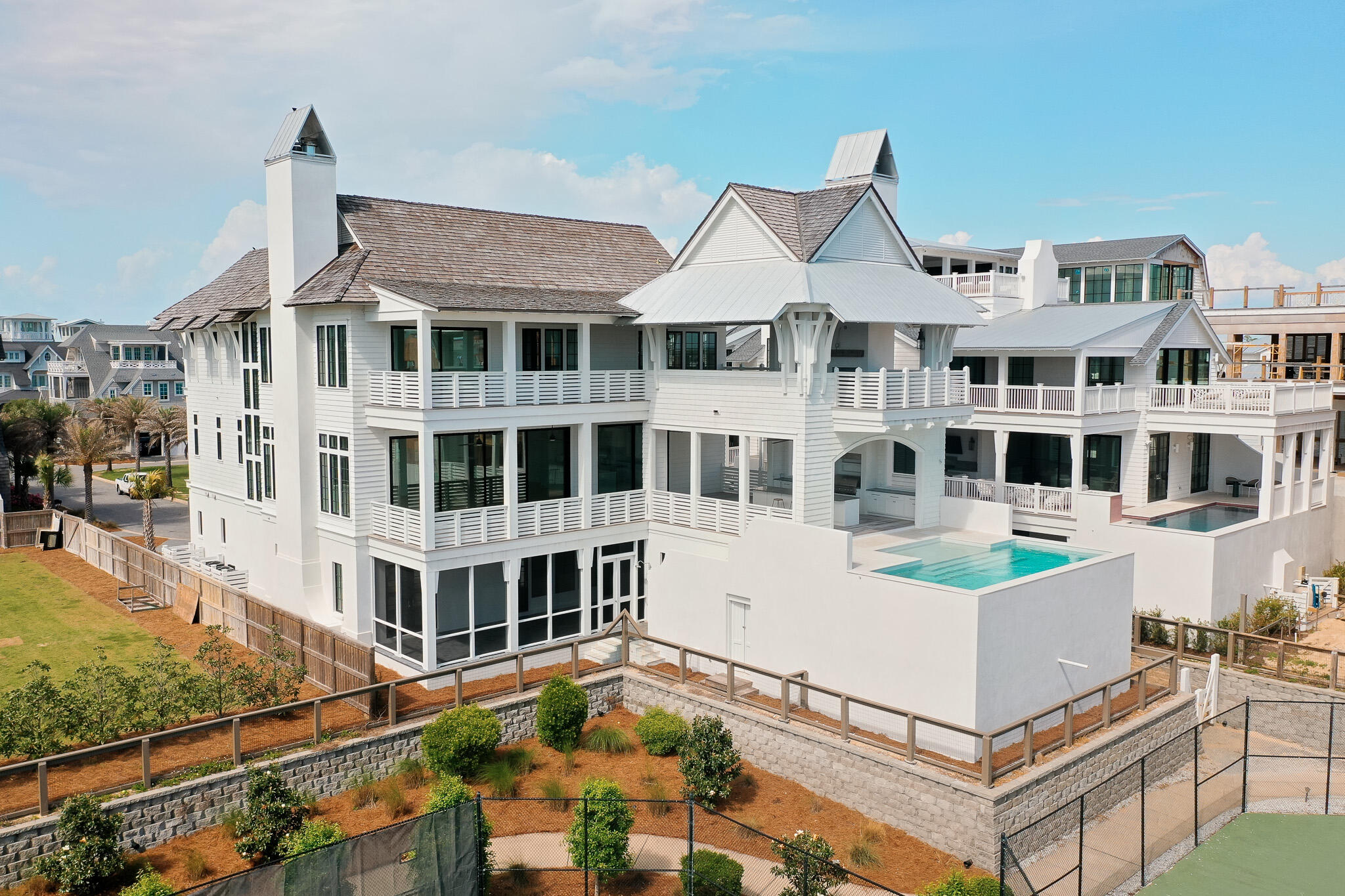 264 Grace Pt Way Watersound, FL 32461 - Photo 63 of 69 a front view of a building with a garden