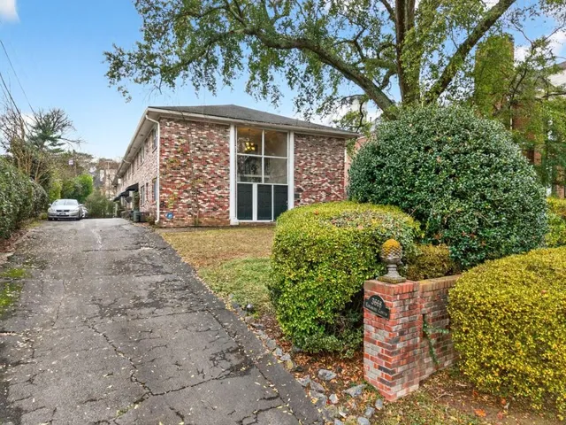 front view of a house with a garden