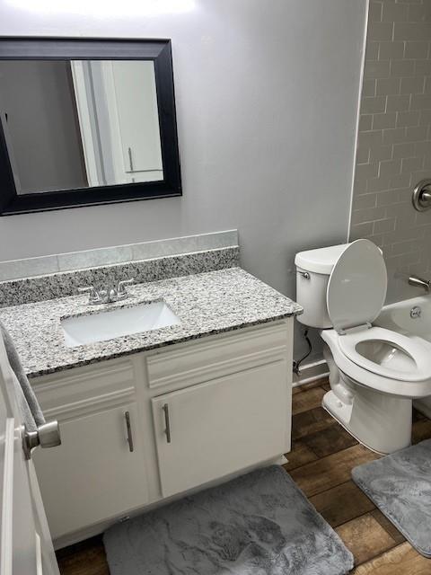 5603 Harvest Hill Road, Unit 2003 Dallas, TX 75230 - Photo 11 of 11 a bathroom with a toilet sink and mirror