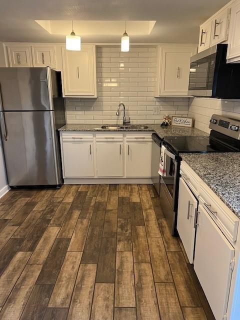 5603 Harvest Hill Road, Unit 2003 Dallas, TX 75230 - Photo 3 of 11 a kitchen with a sink a stove top oven and refrigerator