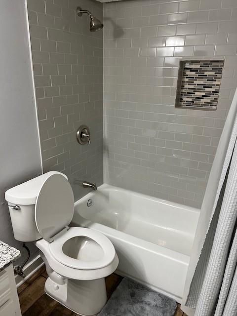 5603 Harvest Hill Road, Unit 2003 Dallas, TX 75230 - Photo 10 of 11 a bathroom with a toilet and a bathtub