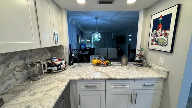 a kitchen with a sink and cabinets