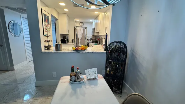 a view of a hallway with seating area